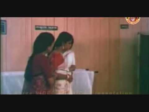 Kannadi Puzhayude Kadavathu Lyrics – Bharya Movie